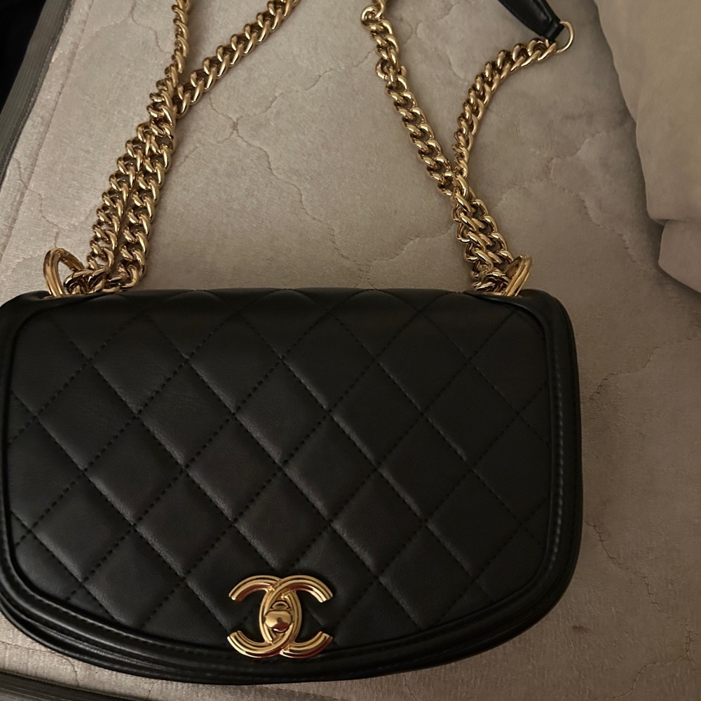 CHANEL Black Quilted Shoulder Bag with Gold Accents